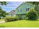 Attractive home showcasing its green exterior, well-kept lawn, and curb appeal at 936 Tyrell Dr, Austell, GA 30106