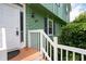 Close-up of the front door and porch with white railings, and the house number 936 at 936 Tyrell Dr, Austell, GA 30106