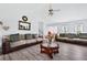 Bright living room with laminate floors, comfy seating, and vaulted ceilings at 936 Tyrell Dr, Austell, GA 30106