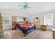 Bright main bedroom offering built-in storage, neutral walls, and wood-look floors at 936 Tyrell Dr, Austell, GA 30106