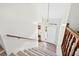 Bright staircase with a white railing, wooden handrail, and stylish steps at 936 Tyrell Dr, Austell, GA 30106
