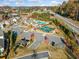 Aerial view of the community amenities including clubhouse, pool, and tennis courts at 1026 Cagle Creek Ovlk, Canton, GA 30115