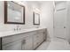 Elegant bathroom features a double vanity, modern sinks, and a view of a glass enclosed shower at 1026 Cagle Creek Ovlk, Canton, GA 30115
