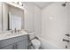 Bathroom features a white shower and tub with chrome fixtures, subway tile, and a toilet at 1026 Cagle Creek Ovlk, Canton, GA 30115