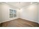 Bright dining room with hardwood floors, modern lighting, and neutral decor at 1026 Cagle Creek Ovlk, Canton, GA 30115