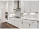 Stylish kitchen showcases stainless appliances, white cabinets, and gas range at 1026 Cagle Creek Ovlk, Canton, GA 30115