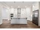 Beautiful kitchen featuring stainless steel appliances, a central island, and stylish white cabinets at 1026 Cagle Creek Ovlk, Canton, GA 30115
