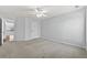 Spacious bedroom with neutral paint, ceiling fan, and plush carpet flooring at 120 Daniel Creek Ln, Sugar Hill, GA 30518