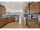 Spacious kitchen with stainless steel appliances and dark wood cabinets at 120 Daniel Creek Ln, Sugar Hill, GA 30518
