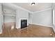 Bright living room featuring a fireplace and shiny hardwood floors at 120 Daniel Creek Ln, Sugar Hill, GA 30518