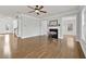Bright and spacious living room with hardwood floors, fireplace, and ample natural light at 120 Daniel Creek Ln, Sugar Hill, GA 30518