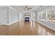 Bright and spacious living room with hardwood floors, fireplace, and ample natural light at 120 Daniel Creek Ln, Sugar Hill, GA 30518