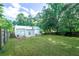 Spacious backyard with lush green grass, mature trees, and a privacy fence at 1279 Skyhaven Se Rd, Atlanta, GA 30316