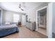 Comfortable bedroom with ceiling fan, hardwood floors, and an attached ensuite bathroom at 1279 Skyhaven Se Rd, Atlanta, GA 30316