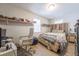 Cozy bedroom featuring a wooden headboard, light hardwood floors, and bright natural light at 1279 Skyhaven Se Rd, Atlanta, GA 30316