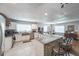 Bright kitchen with white cabinets, stainless steel appliances, granite counters, mosaic backsplash and breakfast bar at 1279 Skyhaven Se Rd, Atlanta, GA 30316