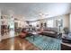 Spacious open-concept living room and kitchen, complete with hardwood floors, granite counters and modern ceiling fan at 1279 Skyhaven Se Rd, Atlanta, GA 30316