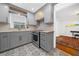 This kitchen offers gray cabinets, stainless steel appliances, and an eat-in area at 52 Chaumont Nw Sq, Atlanta, GA 30327