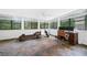 Bright sunroom with slate floors, multiple windows, and outdoor views at 52 Chaumont Nw Sq, Atlanta, GA 30327