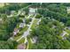 Aerial view of homes nestled among mature trees in a peaceful neighborhood at 55 Legend Creek Cv, Douglasville, GA 30134