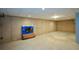 Unfinished basement presents a blank canvas with concrete walls and floor, ready for customization and ample storage at 55 Legend Creek Cv, Douglasville, GA 30134