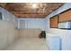 Unfinished basement showing potential storage space, insulation, window, and a utility area at 55 Legend Creek Cv, Douglasville, GA 30134
