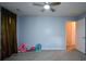 Bedroom featuring neutral walls, carpet flooring, and window with dark drapes at 55 Legend Creek Cv, Douglasville, GA 30134