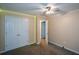 Bedroom featuring neutral walls, carpet flooring, and a double door closet at 55 Legend Creek Cv, Douglasville, GA 30134