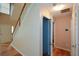 Bright foyer features hardwood floors, a staircase, and access to various rooms, offering a welcoming entry at 55 Legend Creek Cv, Douglasville, GA 30134