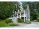 View of a charming two-story home with a inviting front porch and walkway at 55 Legend Creek Cv, Douglasville, GA 30134