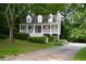 Charming home with a welcoming front porch and landscaped front yard at 55 Legend Creek Cv, Douglasville, GA 30134