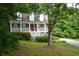 Charming two-story home with a welcoming front porch and landscaped front yard at 55 Legend Creek Cv, Douglasville, GA 30134