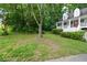 View of the front yard and porch of a home at 55 Legend Creek Cv, Douglasville, GA 30134