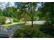 View of the street and front yard from the home's front porch at 55 Legend Creek Cv, Douglasville, GA 30134