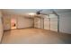 Spacious two-car garage with ample room for parking and storage, equipped with functional garage doors at 55 Legend Creek Cv, Douglasville, GA 30134