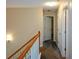 Well-lit upper hallway with neutral walls and carpet, providing access to multiple rooms at 55 Legend Creek Cv, Douglasville, GA 30134