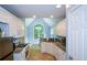 Eat-in kitchen featuring white cabinets, granite counters, and an arched window overlooking the breakfast area at 55 Legend Creek Cv, Douglasville, GA 30134