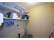A functional laundry room with shelving at 55 Legend Creek Cv, Douglasville, GA 30134