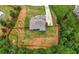 Large, landscaped lot featuring a two-story home with privacy fence, long driveway and mature trees at 7532 Milford Pl, Douglasville, GA 30135