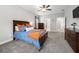Spacious bedroom with a ceiling fan, carpet, and en-suite bathroom at 7532 Milford Pl, Douglasville, GA 30135
