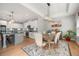Open-concept dining area connecting the kitchen and dining table with modern decor at 7532 Milford Pl, Douglasville, GA 30135