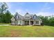 Charming home featuring stone accents, manicured landscaping, and a welcoming front entrance at 7532 Milford Pl, Douglasville, GA 30135