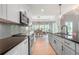 Modern kitchen features an island, stainless appliances, and plenty of natural light at 7532 Milford Pl, Douglasville, GA 30135
