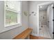 Mud room with bench seating, a window and neutral paint at 7532 Milford Pl, Douglasville, GA 30135
