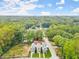 Aerial view of new construction homes with a tree-lined surrounding at 1695 Thomas St, Decatur, GA 30032