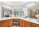 Spacious bathroom with double sinks, a large mirror, and tiled floors and walls at 233 Hampton Station Blvd, Canton, GA 30115