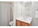 Bathroom featuring a vanity with a white countertop, a mirror, a towel rack, and a shower with a curtain at 233 Hampton Station Blvd, Canton, GA 30115