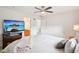 Bright bedroom with white walls, neutral carpet, TV and access to bathroom at 233 Hampton Station Blvd, Canton, GA 30115