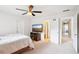Bedroom with white walls, neutral carpet, and TV and access to bathroom at 233 Hampton Station Blvd, Canton, GA 30115