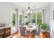 Bright dining area with natural light, hardwood floors, and stylish decor at 233 Hampton Station Blvd, Canton, GA 30115